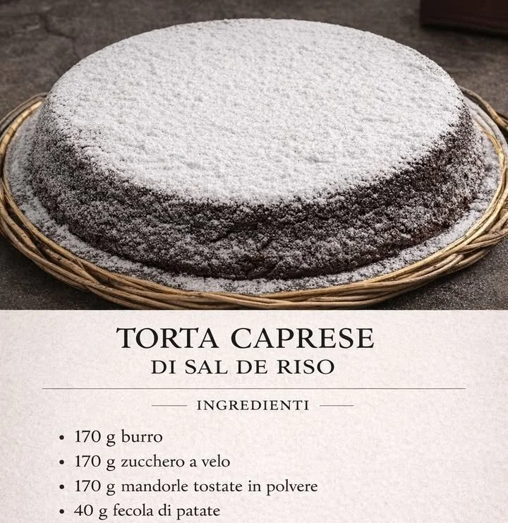 Torta Caprese di Sal De Riso decorata con cacao e mandorle