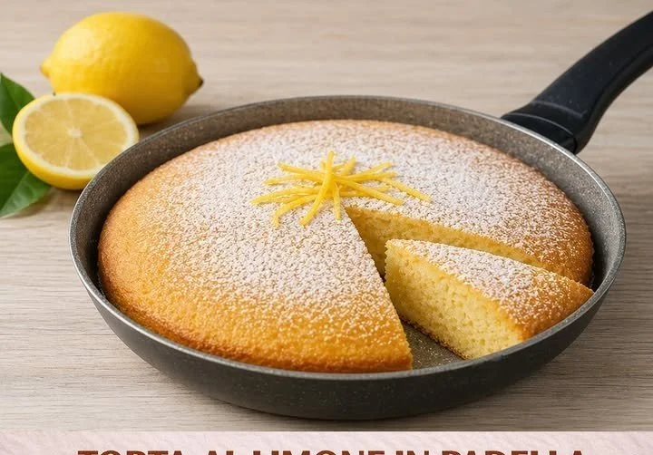 Torta soffice al limone decorata con zeste di limone e zucchero a velo